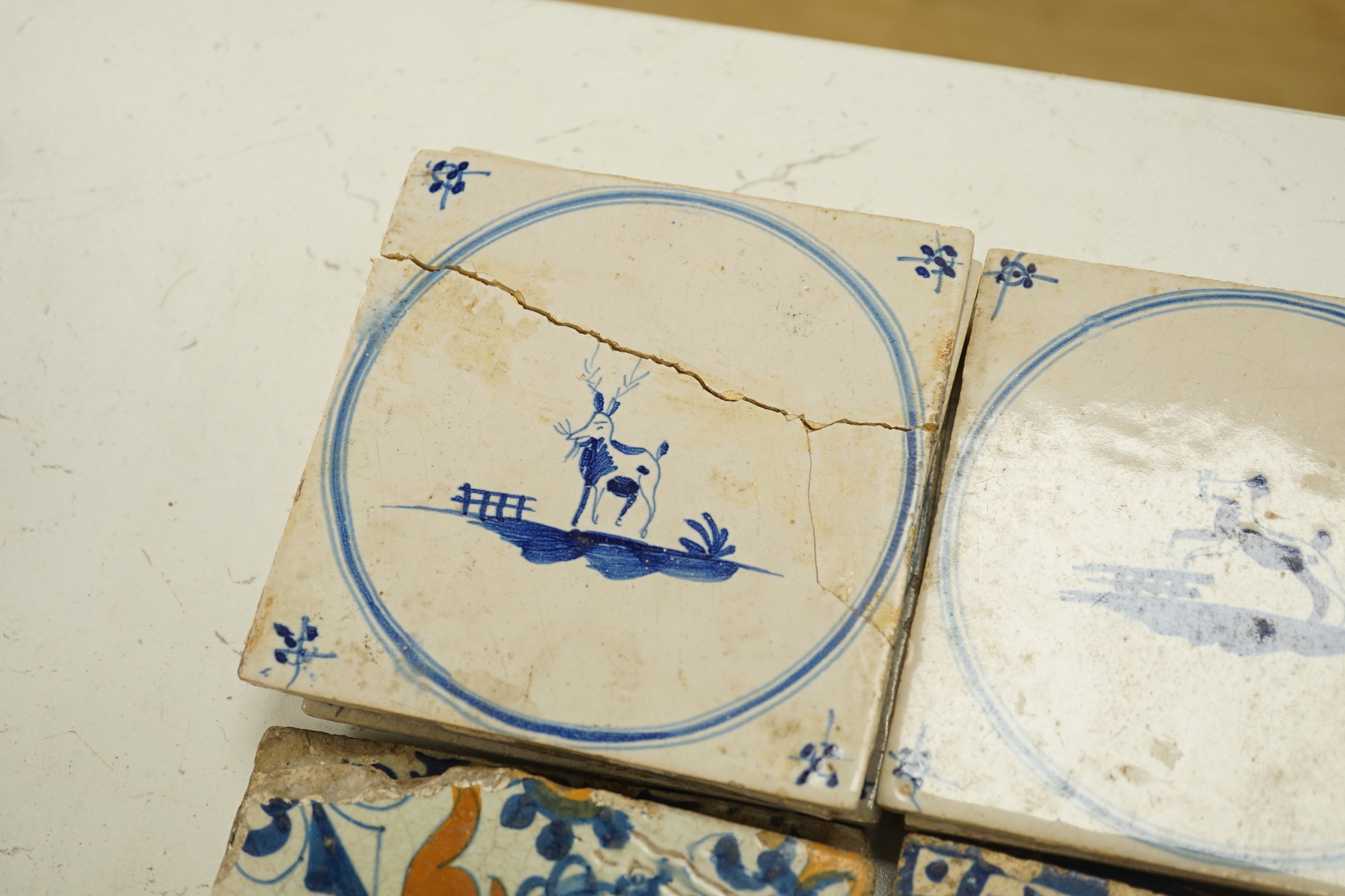 Four 18th century Delft tiles and nine 19th-century Delft blue and white animal tiles(13)